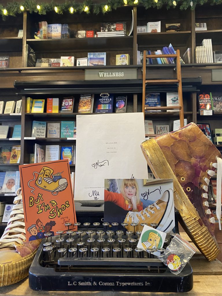 But I'm a Shoe merchandise signed by Janet Varney placed at the River Lights Bookstore in Dubuque Iowa